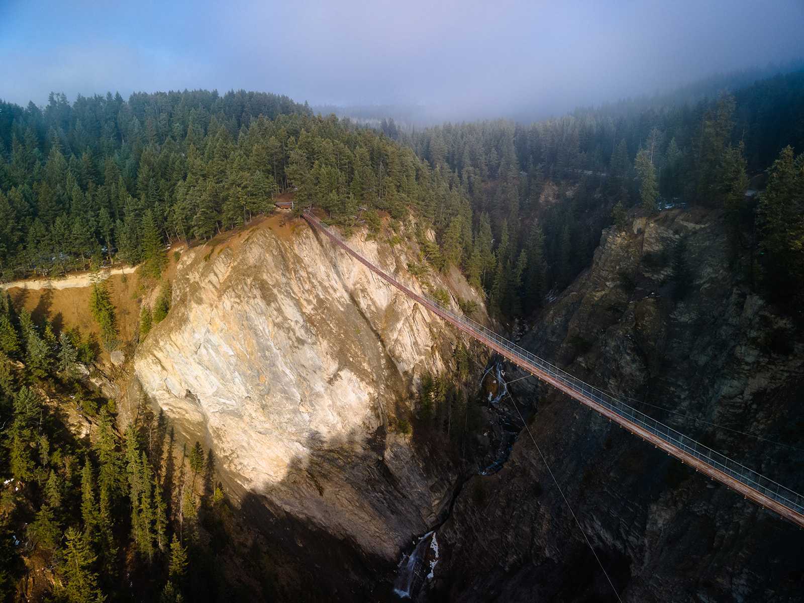The Golden Skybridge hanging over a canyon.